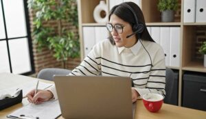 Call centre worker completing document