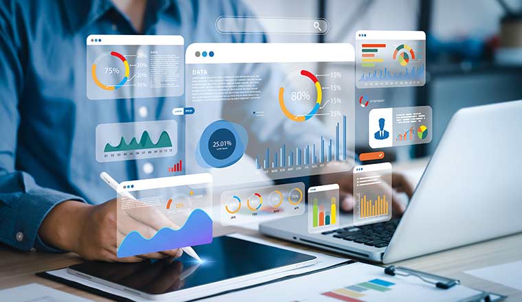 Dashboard design concept with graphs and charts above laptop