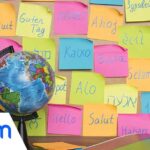 A globe and color notes with the word Hello in different languages