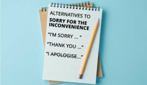 Notepad and pencil with the words alternatives to sorry for the inconvenience