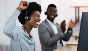 Celebrating, cheering and success with a call center agent