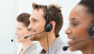 Closeup Of Happy Telephone Operators In A Row