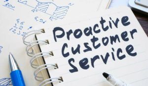 Proactive customer service marks on notebook.