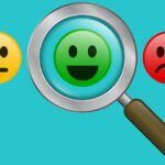 Magnifying glass with positive and negative emoticon