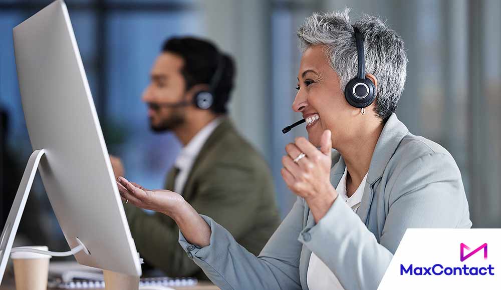 Happy person working at desk with computer screen