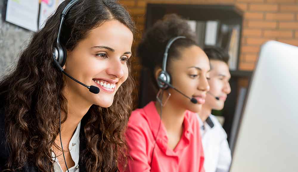 Call centre agents working at desks