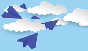 5 paper aeroplanes moving through 5 paper clouds