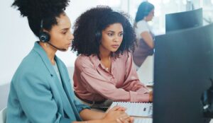 Call centre workers engaged in coaching session