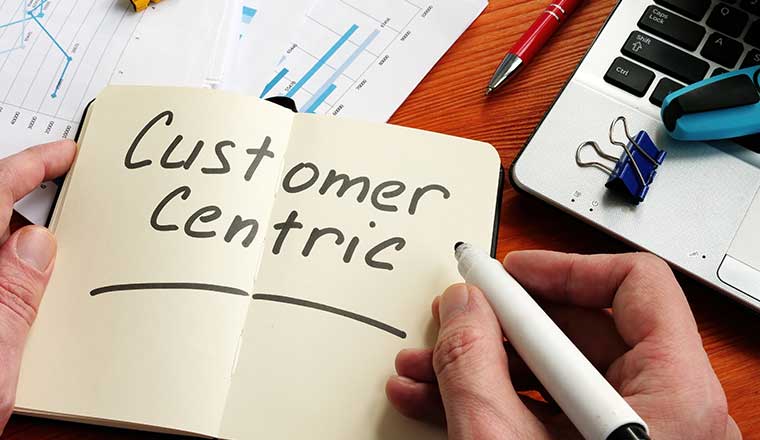 Customer Centric strategy concept with the words written on notepad