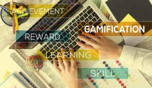 Workplace gamification concept with laptop and the words gamification, skill, reward, achievement, and learning