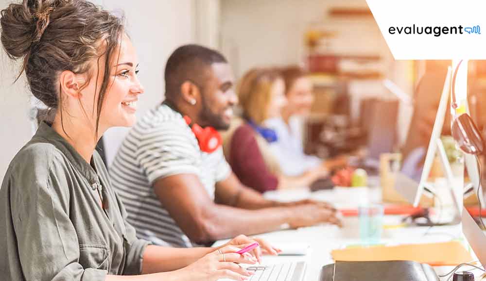 Happy employees working at desks