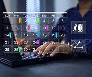 Laptop and calendar scheduling concept