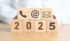 2025 in wood blocks with a call centre phone in a wooden block, an @ symbol and a email symbol