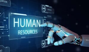 Robot hand pointing to the word 'Human Resources' on a digital screen.