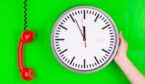 Phone and clock on a green background