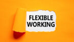 The words flexible working being shown as paper ripped away