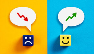 Sad and happy blocks with up and down graph arrows