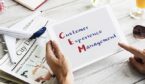 The word 'Customer Experience Management' on a tablet