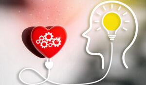 Empathy concept with head shape and lightbulb connected to heart