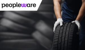 Lots of tyres with someone holding one
