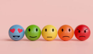 Five faces on a pink background