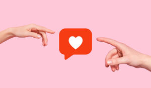2 hands pointing at a love heart