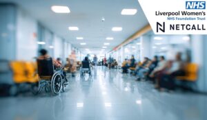 A blurred image depicts a hospital waiting area with numerous people, some in wheelchairs, seated along a long corridor.