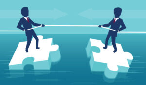 2 people pulling themself on iceburg jigsaw pieces
