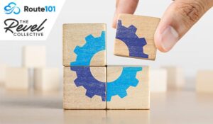 Hand putting the last piece of wooden blocks with the gear icon