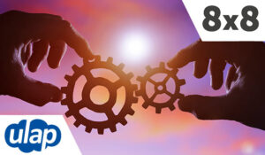 two gears in the hands of people at sunset