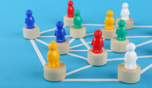 Multi coloured figures on blocks with lines connecting them