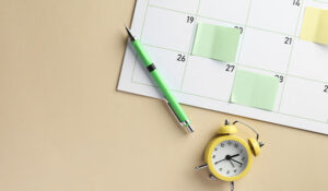 Calendar with a pen and a clock