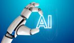 Robot hand holding the word AI