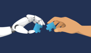 Robot and human hand putting jigsaw pieces together