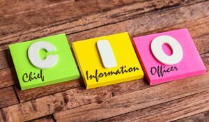 Colorful square papers with wooden white letters for the acronym word CIO means Chief Information Officer