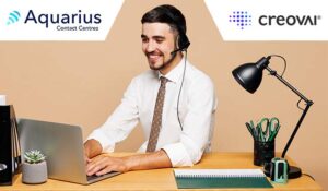 Male working on his laptop with a headset on