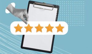 Person holding 5 stars over the top of a clipboard