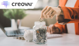 Person putting money into a money jar