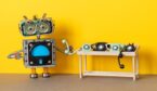 Robot holding a telephone on a table