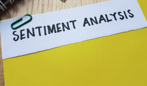 Sentiment analysis writing on table background.