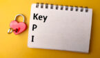 The letters KPI on a notebook with a lock and key next to it