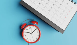 A calendar with a clock on a blue background