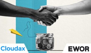 2 People shaking hands over a money jar