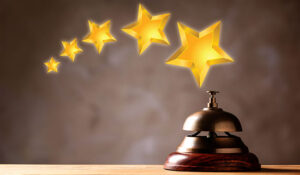 Five Star Luxury Hotel. Service bell on wooden table