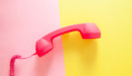 Phone or handset on yellow and pink background