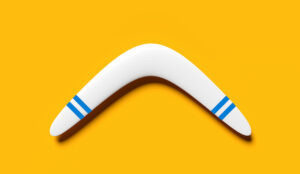 Minimalist image of a white boomerang with blue stripes lying on a yellow background,