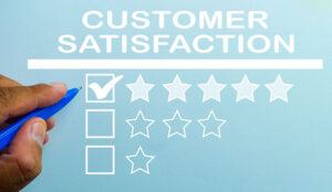 Hand putting check mark a checkbox on five star rating