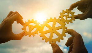 Teamwork concept - 3 cogs working together