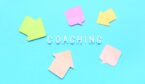 coaching word on blue background