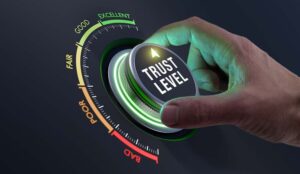 Trust building concept with a gauge being turned to excellent